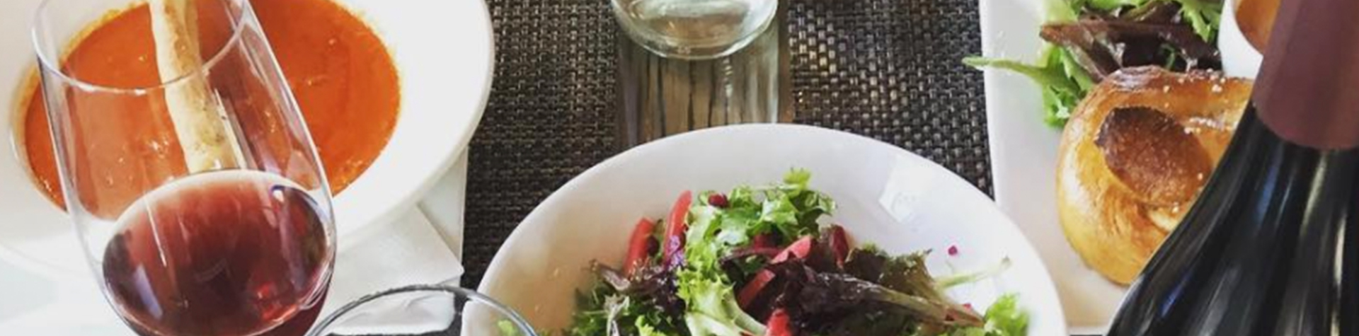 FOOD SLIDER NARROW 1_0000_Screen Shot 2020-12-22 at 4.26.15 PM Wine and Plated Food Closeup