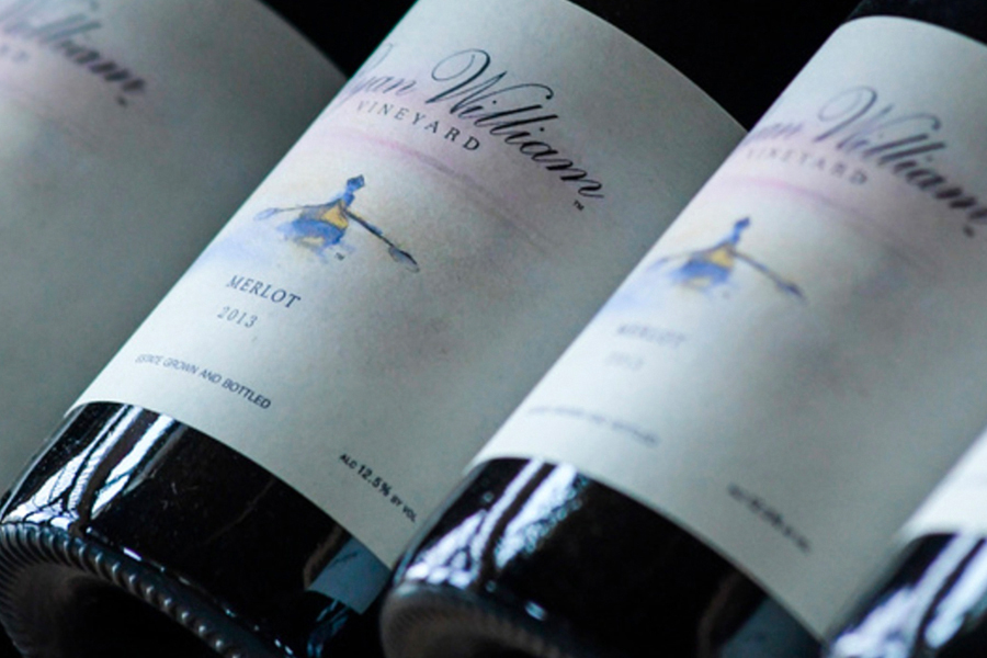 Closeup of Bottle Labels in Rack